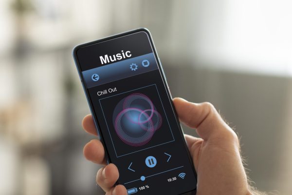 man-holding-smartphone-with-home-automation-app